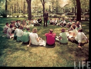 Ervin, Christopher. "Students sitting in circle listening to teacher outside on campus of New Trier High School." Photograph. Teaching Portfolio. WordPress, June 1950. Web. 27 Apr. 2016.