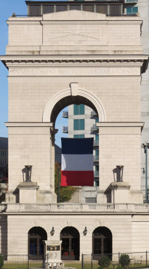 The Gate during the daytime with the Paris flag in the middle to support them when they were going through a crisis