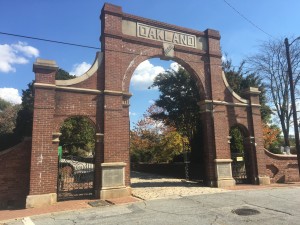 Gate entrance to Oakland Cemetery, with historic marker to the right 