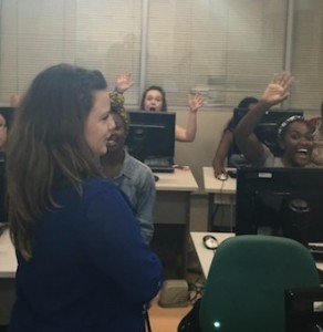 Carol teaches the class about publicly available datasets, while students wave to the paparazzi.