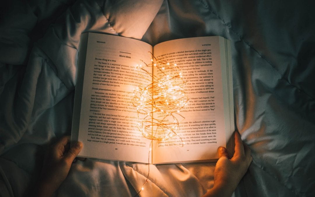 Open book with fairy lights in the middle