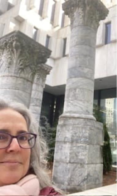 Dr. Davis in front of the Equitable columns at 25 Park Place NE