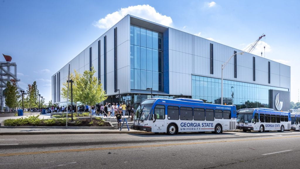 GSU shuttles line up outside Convocation Center to pick up students.
