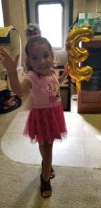 Cute Toddler waiving on her third birthday