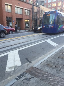 This is a picture of the Atlanta Street Car and how it runs through the middle of a narrow word. The purpose of this photo is to show part of how Auburn Avenue is structured. The street car makes parking difficult for drivers and bicyclist since there isn’t a lane for them to ride through. 