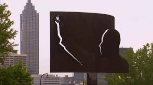 Sculpture outline of Martin Luther King superimposed on the Atlanta skyline