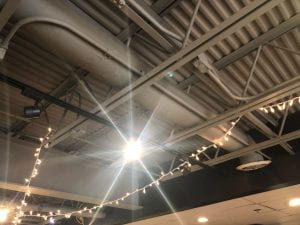 Spotlight shining down over baristas at Ebrik.